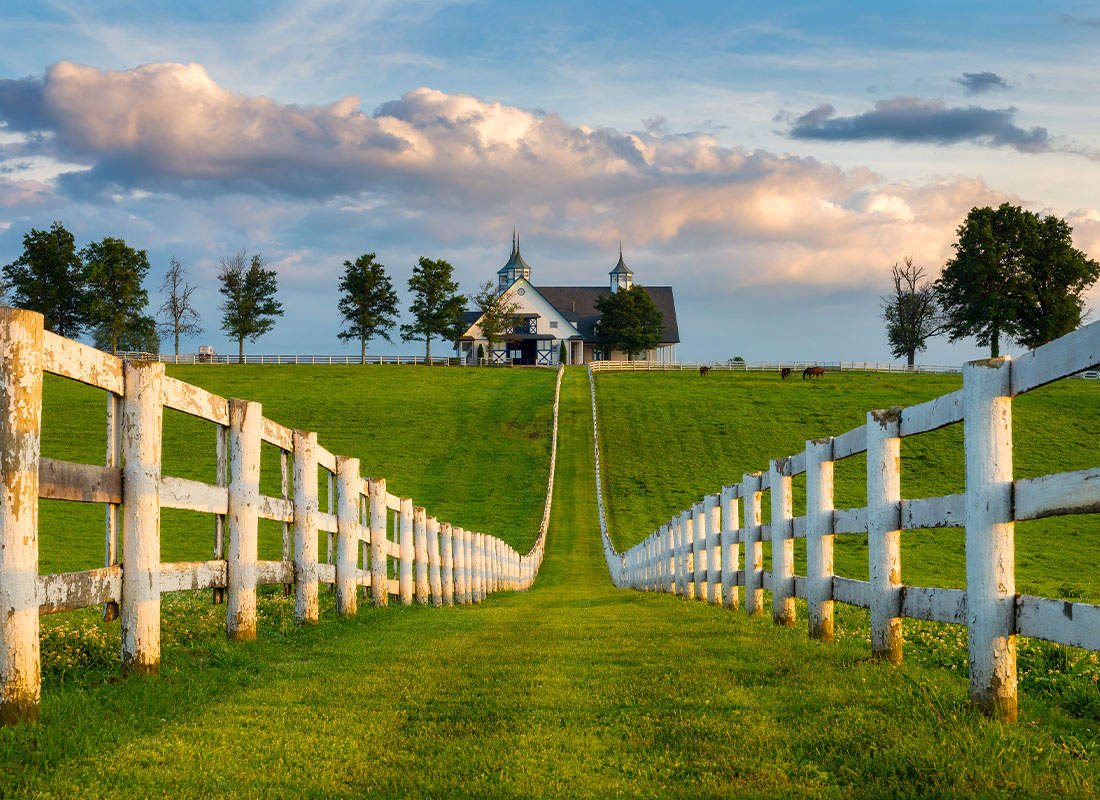 Lexington, KY - View of a Horse Farm and Long Fence Leading up to Main Property